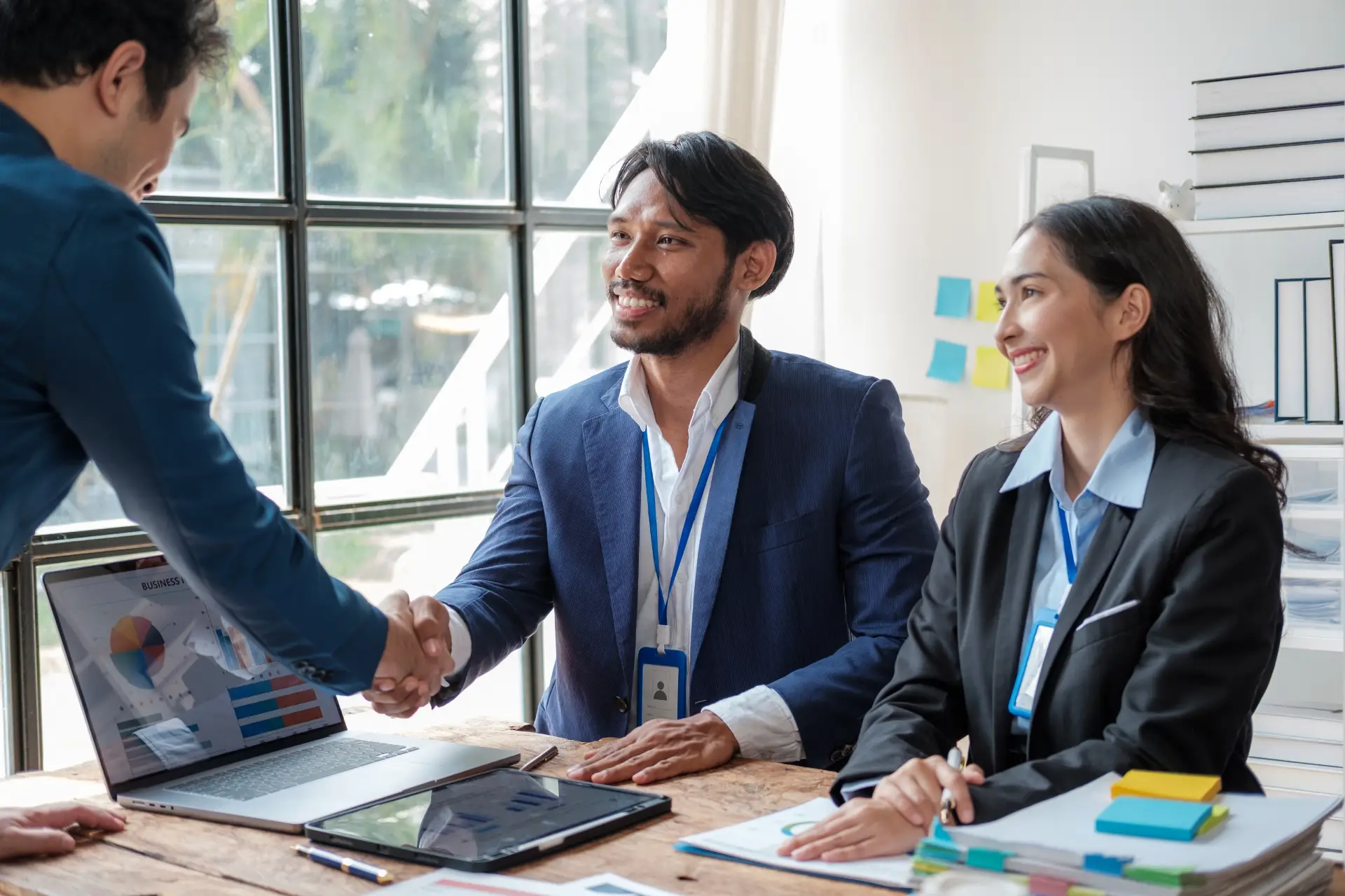 young-business-people-shaking-hands-in-the-office-2026-01-07-01-26-39-utc